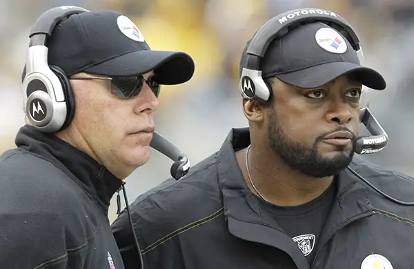Pittsburgh Steelers head coach Mike Tomlin, right, and offensive coordinator Bruce Arians watch from the sidelines during the second quarter of an NFL football game against the Cincinnati Bengals in Pittsburgh, Sunday, Dec 4, 2011. The Steelers won 35-7. (AP Photo/Gene J. Puskar)