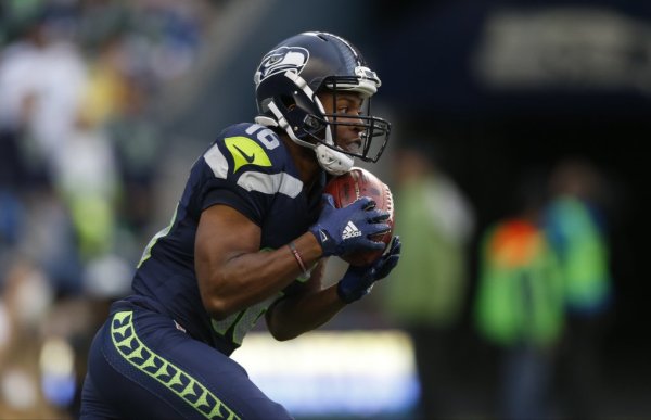 Seattle Seahawks wide receiver Tyler Lockett (16) begins to run a 103-yard kickoff return for a touchdown against the Denver Broncos in the first half of a preseason NFL football game, Friday, Aug. 14, 2015, in Seattle. (AP Photo/John Froschauer) OTK