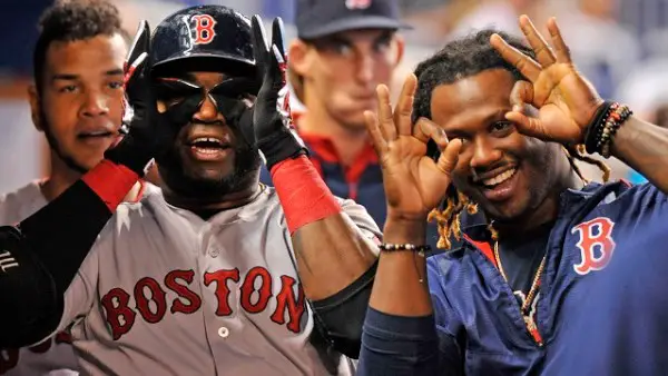 Aug 12, 2015; Miami, FL, USA; Boston Red Sox first baseman David Ortiz (left) celebrates with left fielder Hanley Ramirez (right) after Ortiz hit  a solo home run during the second inning against the Miami Marlins at Marlins Park. Mandatory Credit: Steve Mitchell-USA TODAY Sports